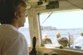 Tour guide inside boat speaking into microphone Footage