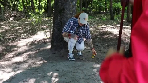 Tour guide inside chernobyl exclusion zone finding a high dose pocket of radi Stock Footage 129347319