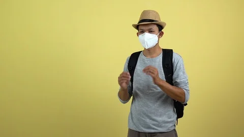 A tourism using a mask for protect an air toxic for travel around the world. Stock Footage 123777432