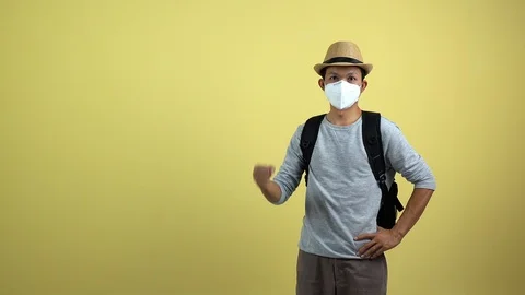 A tourism using a mask for protect an air toxic for travel around the world. Stock Footage 123777439