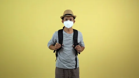 A tourism using a mask for protect an air toxic for travel around the world. Stock Footage 123777663