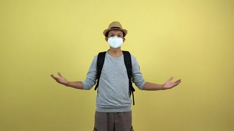 A tourism using a mask for protect an air toxic for travel around the world. Stock Footage 123777872