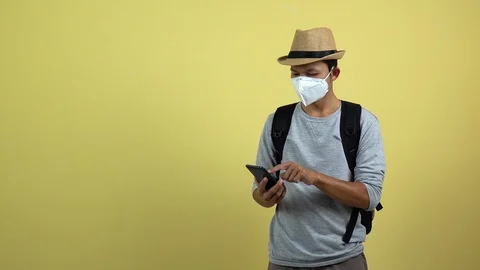 A tourism using a smart phone for checking an air toxic in real time. Stock Footage 123776917