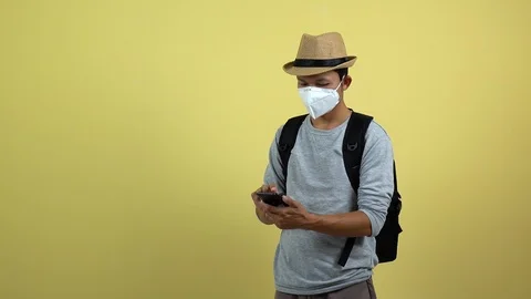 A tourism using a smart phone for checking an air toxic in real time. Stock Footage 123777326