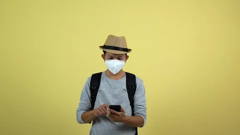 A tourism using a smart phone for checking an air toxic in real time. Stock Footage 123777380