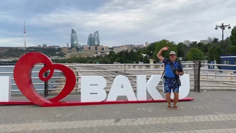 Tourist with a backpack and a camera walks through the city Stock Footage 316879560
