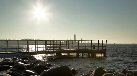 Tourist with backpack looking at the cold Baltic sea in winter time Stock Footage 58937959
