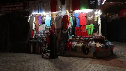 Tourist with a backpack in a small oriental store, chooses souvenirs . Stock Footage 119238013