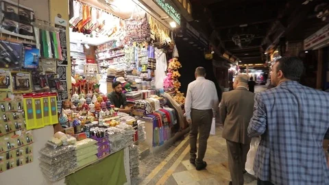 Tourist with a backpack in a small oriental store, chooses souvenirs . Stock Footage 119238429