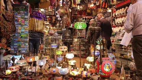 Tourist with a backpack in a small oriental store, chooses souvenirs . Stock Footage 119238443