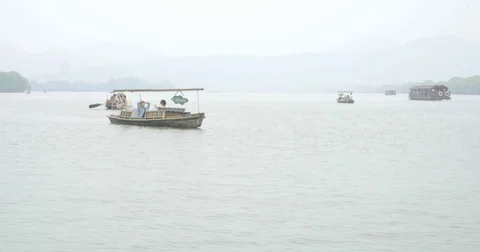 Tourist Boat Floating Past Camera at West Lake, Hangzhou China in 4K Stock Footage 80389733