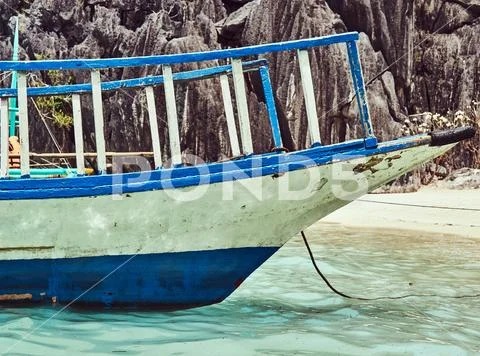 Tourist boat on the shore of a beautiful rocky bay of Philippine Islands Stock Photos