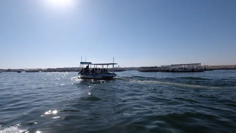 Tourist boats float on the Nile River, at Aswan Egypt Stockbeeldmateriaal 287095352