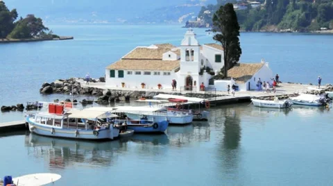 Tourist boats near Vlacherna monastery, Kanoni, Corfu, Greece Stock Footage