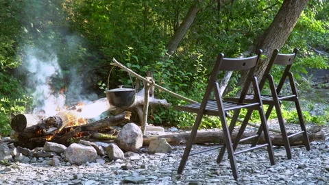 Tourist chairs by the fire Stock Footage 136875019