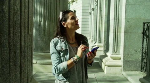 Tourist checking information on smartphone about ancient building, steadycam 動画素材 44100736