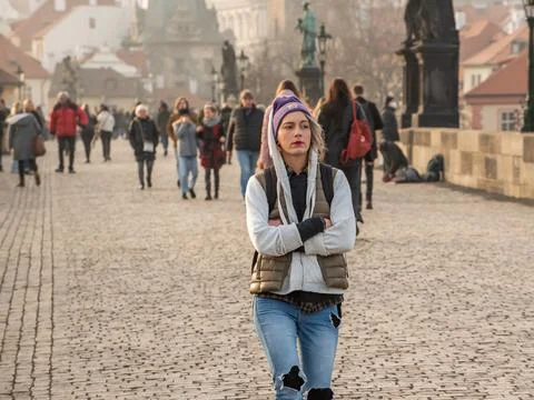 Tourist in the city center of Prague walking and talking on the Charles Bridg Stock Photos