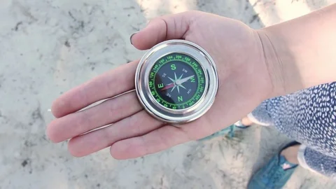 Tourist compass on the background of the beach Stock Footage 78113030