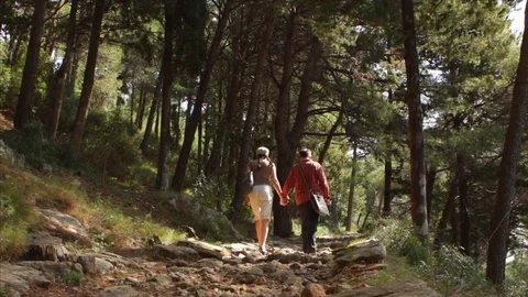 Tourist couple climb up the path on Mount Srd in Dubrovnik, Croatia 動画素材 74017367