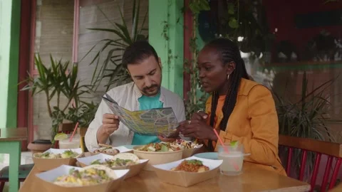 Tourist couple reading map while on vacations in Latin America Stock Footage 244546248