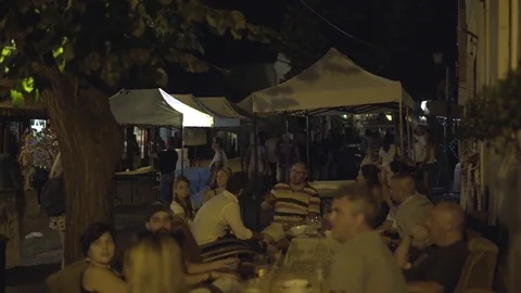 Tourist crowded street at night Stock Footage