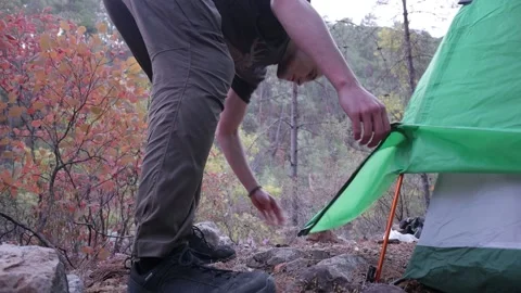 Tourist disassembles tent, hiking in the mountains, tent Stock Footage 200878397