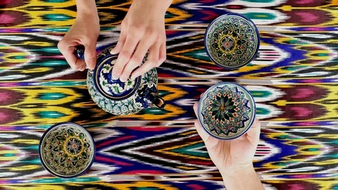 Tourist drinking tea from pials. Samarkand, Uzbekistan. Oriental cuisine Stock Footage 70379206