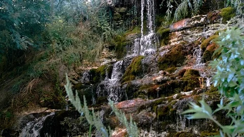 A tourist drinks from a waterfall Video stock 94841347
