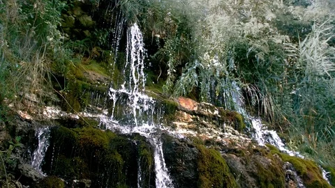 A tourist drinks from a waterfall Video stock 94841761