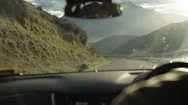 Tourist Driving Car Through Mountain Road On Sunny Day Stock Footage