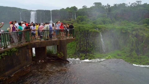 Tourist at the end of the main view point at the Iguazu falls Stock Footage 109510557
