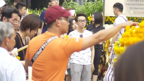 Tourist at Erawan Shrine at Ratchaprasong intersection, 20 May 2018, Bangkok, Stock Footage 90052051