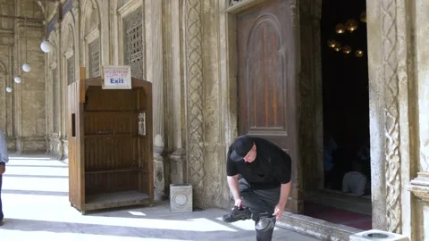 Tourist Exiting Mosque At The Citadel In Cairo, Egypt Stock Footage 157988189