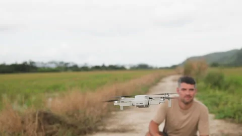 A tourist explores the surroundings using a drone. Stock Footage 321858158