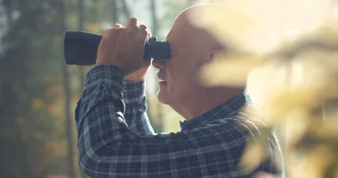 Tourist exploring a forest and using binoculars Stock Footage 151158564