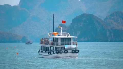 Tourist ferry makes an interesting excursion to a Ha Long Bay Stock Footage 303180720