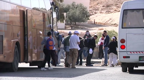 Tourist getting down from bus in Dahab, Egypt Stock Footage 58526255