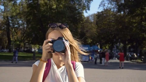 Tourist Girl Taking Photo in Street Stock Footage