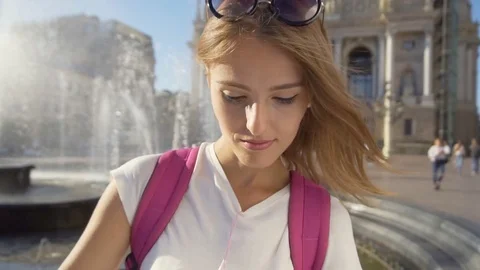 Tourist Girl Watching Map near Fountain Stock Footage