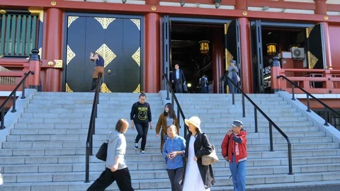 Tourist going down the stairs in Senso-ji Temple in Tokyo Japan Stock Footage 121387839