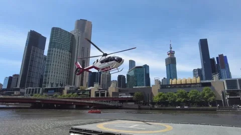 Tourist helicopter taking off beside River of Melbourne. Stock-Footage 336907129
