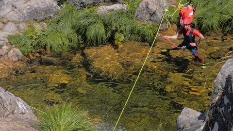 Tourist Kid With Instructor Rappelling Waterfall Stock Footage 127095857