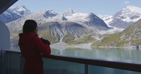 Tourist looking at Alaska Glacier Bay landscape using binoculars on cruise ship Stock Footage 71249529
