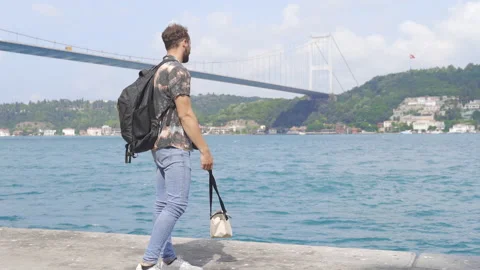 The tourist is looking at the Bosphorus. 스톡 동영상 212828126