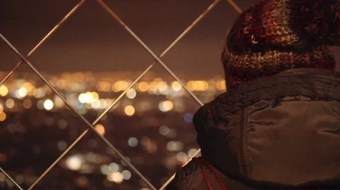 Tourist looking at the city from Eiffel tower top Stock Footage 58768203