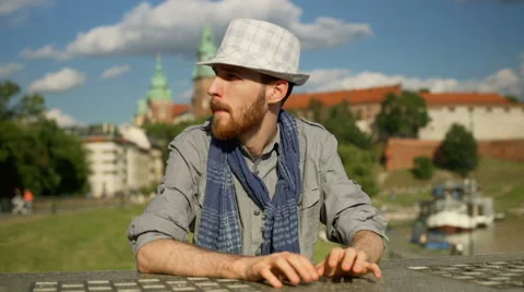 Tourist looking irritated while waiting for someone next to the castle Video stock 67543479