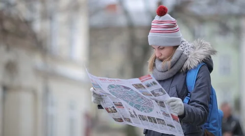 Tourist looking at a map how to get to the center Stock Footage 57525362