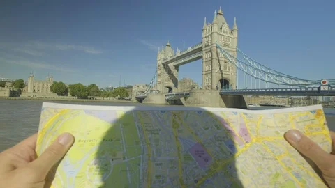 Tourist looking a map with tower bridge behind POV Stock-Footage 95290947