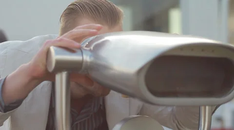 Tourist looking through binoculars Stock Footage 32221904