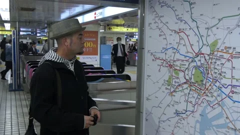 Tourist Looks At Map Inside The Tokyo Metro In Tokyo, Japan Stock Footage 159054835